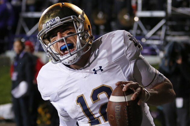 FILE - In this Saturday, Nov. 3, 2018, file photo, Notre Dame's Ian Book celebrates as he scores a touchdown against Northwestern during the second half of an NCAA college football game in Evanston, Ill. Third-ranked Notre Dame will put its unbeaten record on the line when it faces No. 12 Syracuse at New York's Yankee Stadium on Saturday. (AP Photo/Jim Young, File)