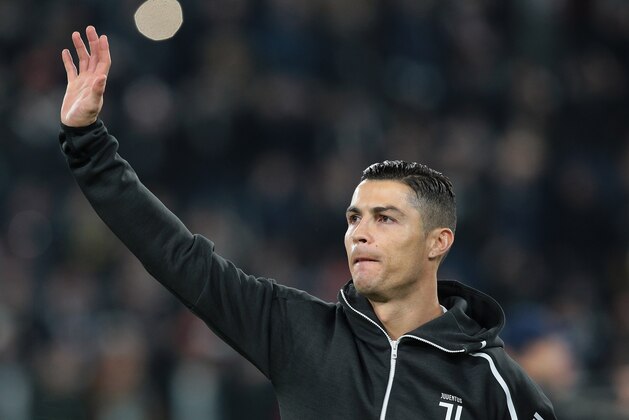 TURIN, ITALY - NOVEMBER 27:  Cristiano Ronaldo of Juventus greets the fans prior to the Group H match of the UEFA Champions League between Juventus and Valencia at Allianz Stadium on November 27, 2018 in Turin, Italy.  (Photo by Emilio Andreoli/Getty Images)