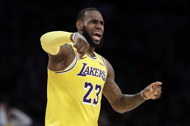Los Angeles Lakers' LeBron James (23) reacts to a foul during the second half of an NBA basketball game against the Miami Heat Monday, Dec. 10, 2018, in Los Angeles. (AP Photo/Marcio Jose Sanchez)