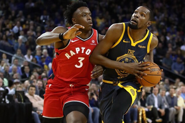 OAKLAND, CA - DECEMBER 12:  Kevin Durant #35 of the Golden State Warriors is guarded by OG Anunoby #3 of the Toronto Raptors at ORACLE Arena on December 12, 2018 in Oakland, California.  NOTE TO USER: User expressly acknowledges and agrees that, by downloading and or using this photograph, User is consenting to the terms and conditions of the Getty Images License Agreement.  (Photo by Ezra Shaw/Getty Images)