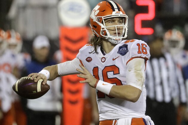 FILE - In this Dec. 1, 2018, file photo, Clemson's Trevor Lawrence (16) looks to pass against Pittsburgh in the first half of the Atlantic Coast Conference championship NCAA college football game, in Charlotte, N.C. No. 2 Clemson once again dominated the Associated Press All-Atlantic Coast Conference teams and individual awards released Tuesday, Dec. 4, 2018. Trevor Lawrence was voted the newcomer of the year. (AP Photo/Chuck Burton, File)