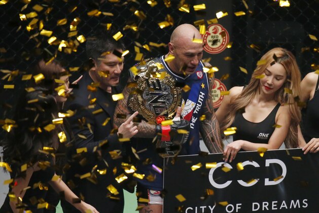 Confetti rain on Brandon Vera after his victory over Mauro Cerilli of Italy in the One Championship Mixed Martial Arts Heavyweight title fight at the Mall of Asia Arena in suburban Pasay city south of Manila, Philippines late Friday Nov. 23, 2018. Vera won over Cerilli via a Knockout in the first minute of the first round. The victory of Vera gives a total five championship belts currently the Philippines is holding in the world of mixed martial arts. (AP Photo/Bullit Marquez)