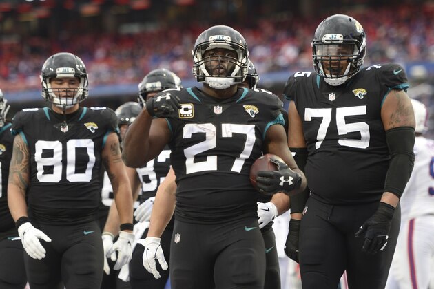 Jacksonville Jaguars running back Leonard Fournette (27) celebrates with teammates after scoring a touchdown run against the Buffalo Bills during the first half of an NFL football game, Sunday, Nov. 25, 2018, in Orchard Park, N.Y. (AP Photo/Adrian Kraus)