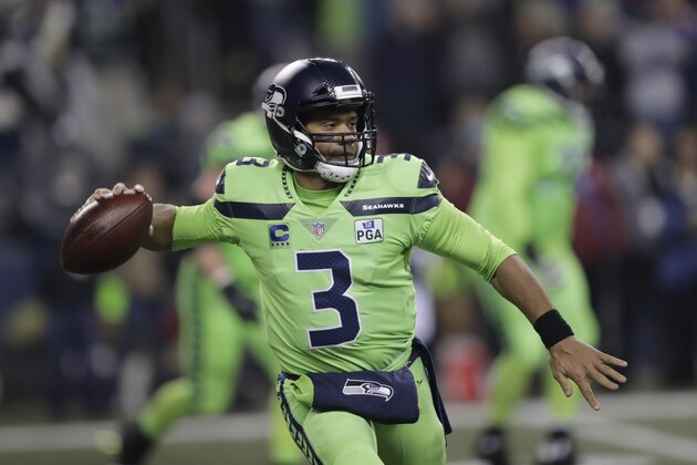 Seattle Seahawks quarterback Russell Wilson throws against the Minnesota Vikings in the first half of an NFL football game, Monday, Dec. 10, 2018, in Seattle. (AP Photo/Stephen Brashear)