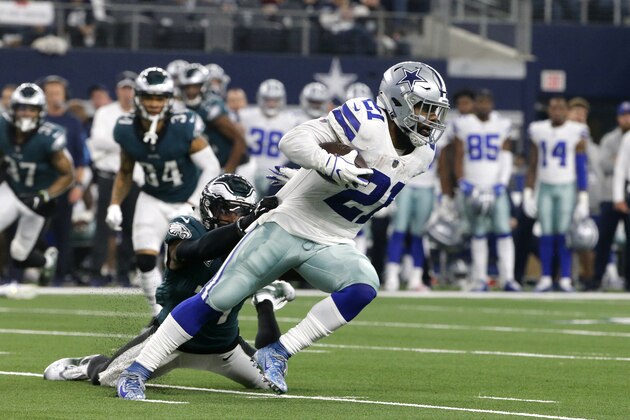 Philadelphia Eagles safety Malcolm Jenkins (27) attempts to stop Dallas Cowboys running back Ezekiel Elliott (21) during the first half of an NFL football game, in Arlington, Texas, Sunday, Dec. 9, 2018. (AP Photo/Michael Ainsworth)