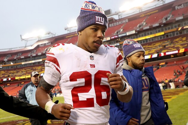 LANDOVER, MARYLAND - DECEMBER 09: Running back Saquon Barkley #26 of the New York Giants runs off the field following their game against the Washington Redskins at FedExField on December 09, 2018 in Landover, Maryland. (Photo by Rob Carr/Getty Images)
