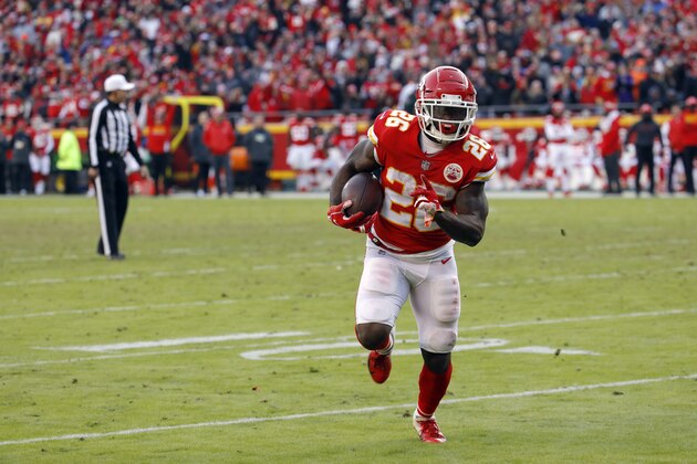 Kansas City Chiefs running back Damien Williams (26) runs for a touchdown during the second half of an NFL football game against the Baltimore Ravens in Kansas City, Mo., Sunday, Dec. 9, 2018. (AP Photo/Charlie Riedel)