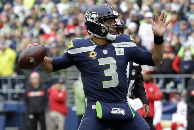 Seattle Seahawks quarterback Russell Wilson passes against the San Francisco 49ers during the first half of an NFL football game, Sunday, Dec. 2, 2018, in Seattle. (AP Photo/Elaine Thompson)