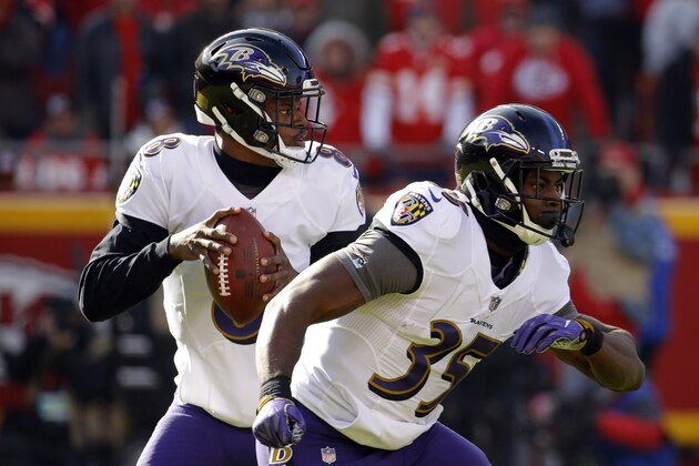 Baltimore Ravens quarterback Lamar Jackson (8) looks for a receiver behind running back Gus Edwards (35) during the first half of an NFL football game in Kansas City, Mo., Sunday, Dec. 9, 2018. (AP Photo/Charlie Riedel)