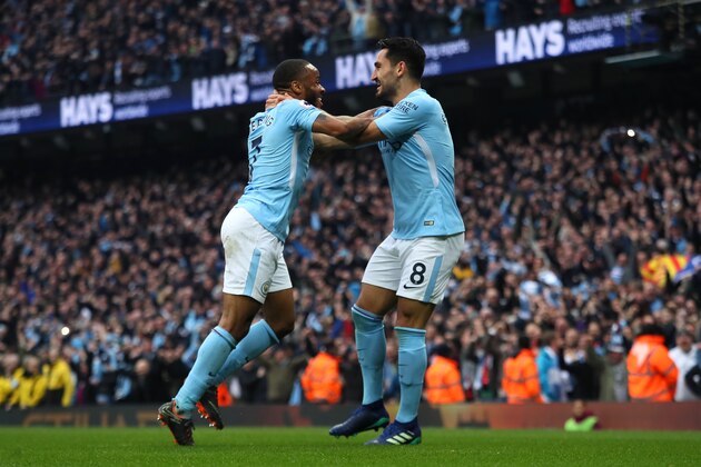 MANCHESTER, ENGLAND - APRIL 07:  Ilkay Gundogan of Manchester City celebrates scoring a goal to make the score 2-0 with Raheem Sterling during the Premier League match between Manchester City and Manchester United at Etihad Stadium on April 7, 2018 in Manchester, England. (Photo by Matthew Ashton - AMA/Getty Images)