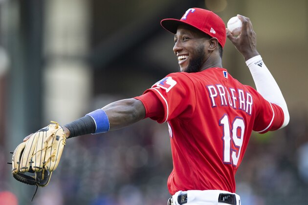 Texas Rangers shortstop Jurickson Profar (19) warms up before the teams game against the Colorado Rockies, Friday, June 15, 2018, in Arlington, Texas. (AP Photo/Sam Hodde)