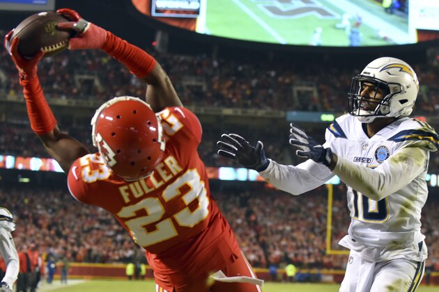 Kansas City Chiefs cornerback Kendall Fuller (23) intercepts a pass intended for Los Angeles Chargers wide receiver Tyrell Williams (16) during the first half of an NFL football game in Kansas City, Mo., Thursday, Dec. 13, 2018. (AP Photo/Ed Zurga)