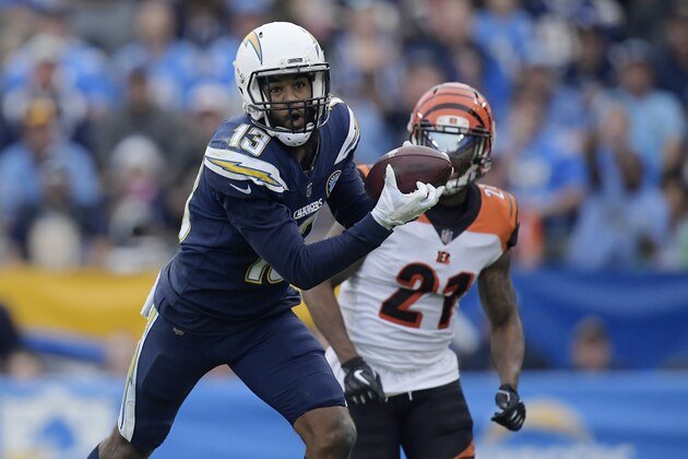 Los Angeles Chargers wide receiver Keenan Allen (13) makes a catch in front of Cincinnati Bengals defensive back Darqueze Dennard (21) during the second half of an NFL football game Sunday, Dec. 9, 2018, in Carson, Calif. (AP Photo/Mark J. Terrill)
