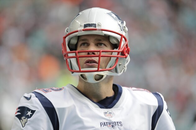 New England Patriots quarterback Tom Brady (12) stands on the sidelines, during the first half of an NFL football game against the Miami Dolphins, Sunday, Dec. 9, 2018, in Miami Gardens, Fla. (AP Photo/Lynne Sladky)