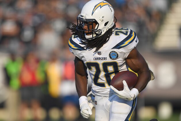 OAKLAND, CA - NOVEMBER 11:  Melvin Gordon #28 of the Los Angeles Chargers carries the ball against the Oakland Raiders during the second half of their NFL football game at Oakland-Alameda County Coliseum on November 11, 2018 in Oakland, California.  (Photo by Thearon W. Henderson/Getty Images)