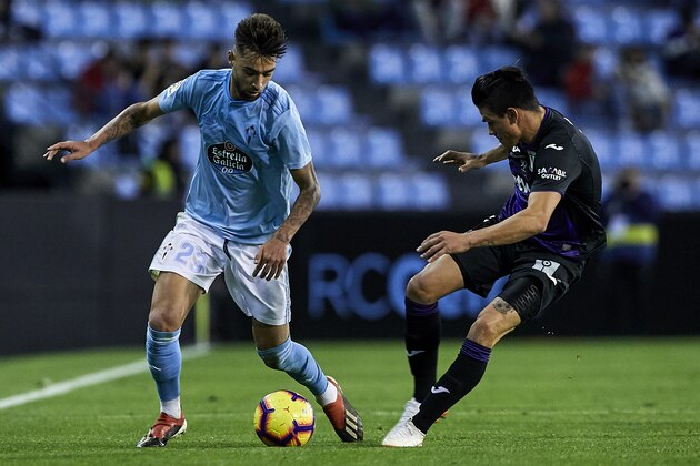 VIGO, SPAIN - DECEMBER 14: Brais Mendez of Celta de Vigo is challenged by Jonathan Silva of CD Leganes during the La Liga match between RC Celta de Vigo and CD Leganes at Abanca-Balaídos on December 14, 2018 in Vigo, Spain. (Photo by Quality Sport Images/Getty Images)