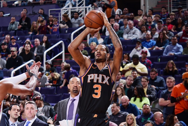 PHOENIX, AZ - DECEMBER 7: Trevor Ariza #3 of the Phoenix Suns shoots the ball against the Miami Heat on December 7, 2018 at Talking Stick Resort Arena in Phoenix, Arizona. NOTE TO USER: User expressly acknowledges and agrees that, by downloading and or using this photograph, user is consenting to the terms and conditions of the Getty Images License Agreement. Mandatory Copyright Notice: Copyright 2018 NBAE (Photo by Michael Gonzales/NBAE via Getty Images)
