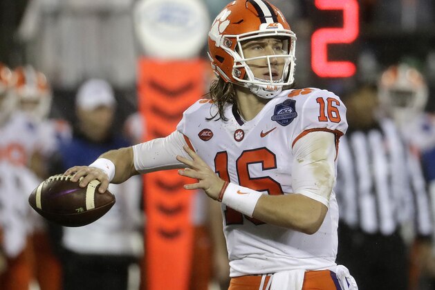 FILE - In this Dec. 1, 2018, file photo, Clemson's Trevor Lawrence (16) looks to pass against Pittsburgh in the first half of the Atlantic Coast Conference championship NCAA college football game, in Charlotte, N.C. No. 2 Clemson once again dominated the Associated Press All-Atlantic Coast Conference teams and individual awards released Tuesday, Dec. 4, 2018. Trevor Lawrence was voted the newcomer of the year. (AP Photo/Chuck Burton, File)