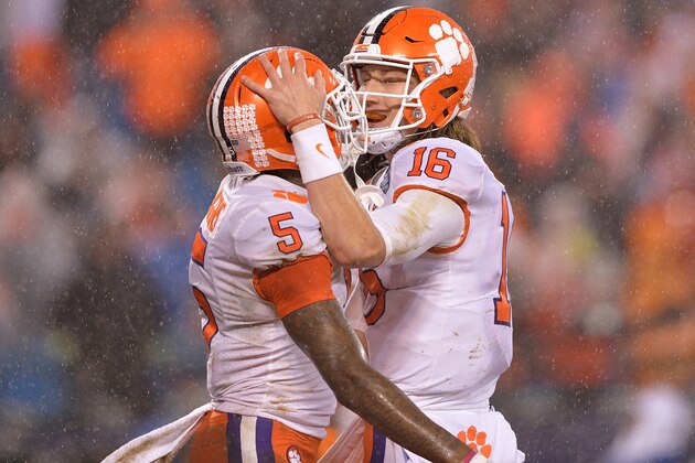 CHARLOTTE, NC - DECEMBER 01:  Tee Higgins #5 celebrates with Trevor Lawrence #16 of the Clemson Tigers after scoring a touchdown against the Pittsburgh Panthers during the second quarter of their game at Bank of America Stadium on December 1, 2018 in Charlotte, North Carolina.  (Photo by Grant Halverson/Getty Images)