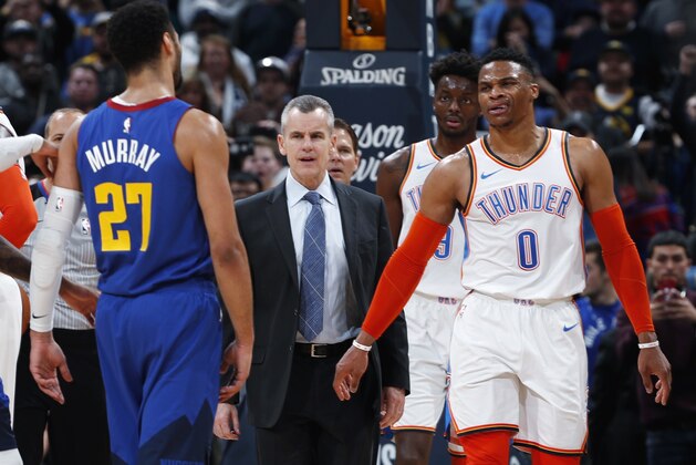Denver Nuggets guard Jamal Murray, left, talks at Oklahoma City Thunder guard Russell Westbrook, right, as head coach Billy Donovan stands between the players after they exchanged words in the second half of an NBA basketball game Friday, Dec. 14, 2018, in Denver. The Nuggets won 109-98. (AP Photo/David Zalubowski)