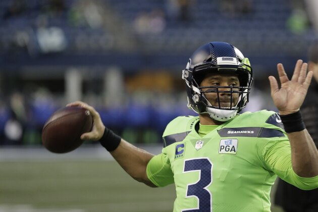 Seattle Seahawks quarterback Russell Wilson warms-up before an NFL football game against the Minnesota Vikings, Monday, Dec. 10, 2018, in Seattle. (AP Photo/Ted S. Warren)