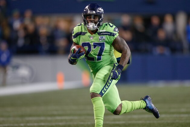 SEATTLE, WA - DECEMBER 10:  Running back Mike Davis #27 of the Seattle Seahawks rushes against the Minnesota Vikings at CenturyLink Field on December 10, 2018 in Seattle, Washington.  (Photo by Otto Greule Jr/Getty Images)