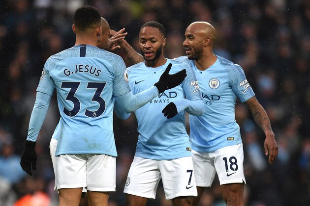 Manchester City's English midfielder Raheem Sterling (C) celebrates scoring his team's third goal during the English Premier League football match between Manchester City and Everton at the Etihad Stadium in Manchester, north west England, on December 15, 2018. (Photo by Oli SCARFF / AFP) / RESTRICTED TO EDITORIAL USE. No use with unauthorized audio, video, data, fixture lists, club/league logos or 'live' services. Online in-match use limited to 120 images. An additional 40 images may be used in extra time. No video emulation. Social media in-match use limited to 120 images. An additional 40 images may be used in extra time. No use in betting publications, games or single club/league/player publications. /         (Photo credit should read OLI SCARFF/AFP/Getty Images)