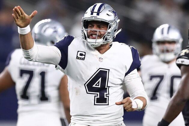 ARLINGTON, TEXAS - NOVEMBER 29:  Dak Prescott #4 of the Dallas Cowboys reacts after running for a first down against the New Orleans Saints in the fourth quarter at AT&T Stadium on November 29, 2018 in Arlington, Texas. (Photo by Ronald Martinez/Getty Images)