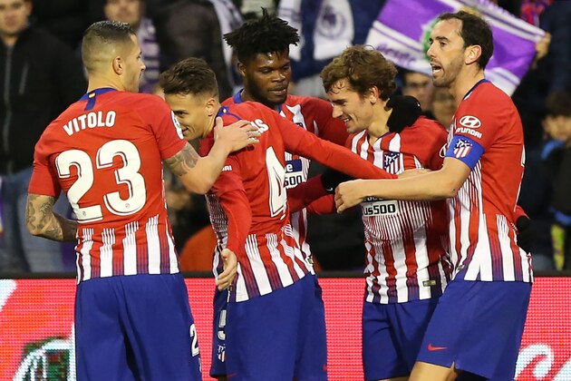 Atletico Madrid's French forward Antoine Griezmann (2ndR) celebrates with teammates after scoring a goal during the Spanish League football match between Real Valladolid and Atletico Madrid at the Jose Zorrilla stadium in Valladolid on December 15, 2018. (Photo by CESAR MANSO / AFP)        (Photo credit should read CESAR MANSO/AFP/Getty Images)