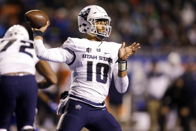 Utah State quarterback Jordan Love (10) looks to throw the ball against Boise State in the second of an NCAA college football game, Saturday, Nov. 24, 2018, in Boise, Idaho. Boise State won 33-24. (AP Photo/Steve Conner) Utah State quarterback Jordan Love (10) looks to throw the ball against Boise State in the second of an NCAA college football game, Saturday, Nov. 24, 2018, in Boise, Idaho. Boise State won 33-24. (AP Photo/Steve Conner)