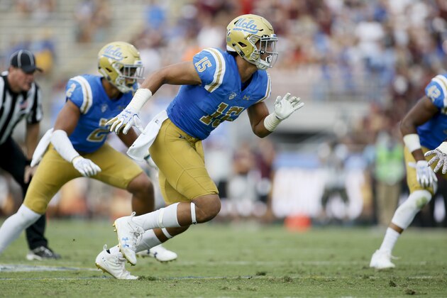 UCLA defensive lineman Jaelan Phillips, right, and linebacker Josh Woods, left, is seen against Texas A&M an NCAA college football game, Sunday, Sept. 3, 2017, in Pasadena, Calif. UCLA won 45-44. (AP Photo/Danny Moloshok)