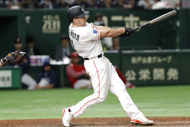 MLB All-Star catcher J.T. Realmuto of the Miami Marlins hits a three-run home-run off All Japan's pitcher Masaru Sato in the eighth inning of Game 2 of their All-Stars Series baseball at Tokyo Dome in Tokyo, Saturday, Nov. 10, 2018. (AP Photo/Toru Takahashi)