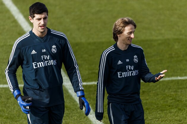 MADRID, SPAIN - DECEMBER 08: Thibaut Courtois and Luka Modric of Real Madrid  smiles during the Real Madrid training session on December 8, 2018 in Madrid, Spain. (Photo by TF-Images/Getty Images)