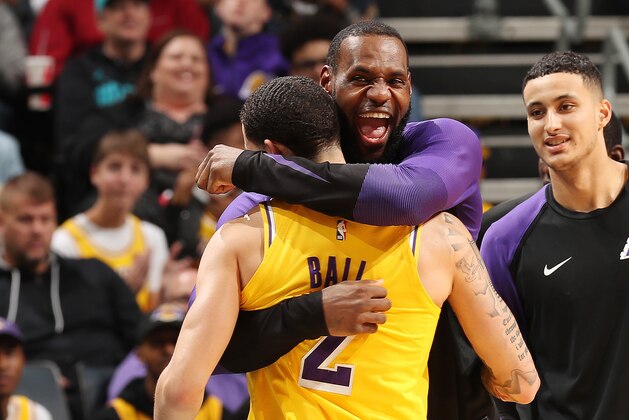CHARLOTTE, NC - DECEMBER 15:  Lonzo Ball #2 and LeBron James #23 of the Los Angeles Lakers react against the Charlotte Hornets on December 15, 2018 at Spectrum Center in Charlotte, North Carolina. NOTE TO USER: User expressly acknowledges and agrees that, by downloading and or using this photograph, User is consenting to the terms and conditions of the Getty Images License Agreement.  Mandatory Copyright Notice:  Copyright 2018 NBAE (Photo by Kent Smith/NBAE via Getty Images)