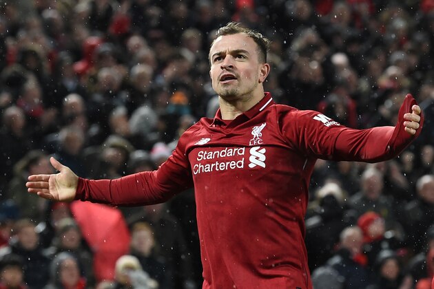 Liverpool's Swiss midfielder Xherdan Shaqiri celebrates scoring their second goal during the English Premier League football match between Liverpool and Manchester United at Anfield in Liverpool, north west England on December 16, 2018. (Photo by Paul ELLIS / AFP) / RESTRICTED TO EDITORIAL USE. No use with unauthorized audio, video, data, fixture lists, club/league logos or 'live' services. Online in-match use limited to 120 images. An additional 40 images may be used in extra time. No video emulation. Social media in-match use limited to 120 images. An additional 40 images may be used in extra time. No use in betting publications, games or single club/league/player publications. /         (Photo credit should read PAUL ELLIS/AFP/Getty Images)
