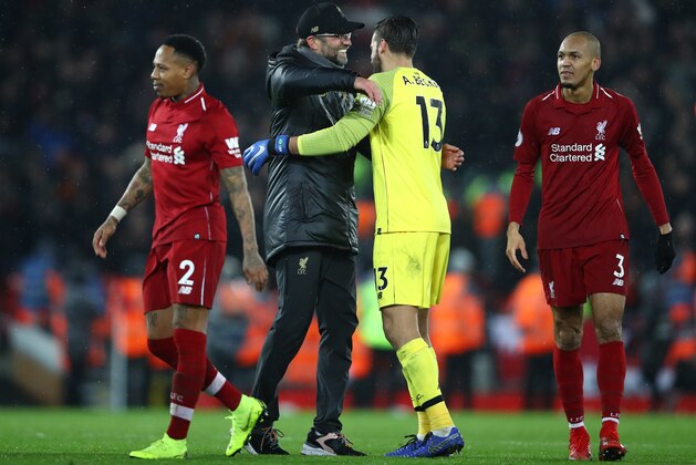 LIVERPOOL, ENGLAND - DECEMBER 16:  Jurgen Klopp, Manager of Liverpool and Alisson of Liverpool celebrate following their sides victory in the Premier League match between Liverpool FC and Manchester United at Anfield on December 16, 2018 in Liverpool, United Kingdom.  (Photo by Clive Brunskill/Getty Images)