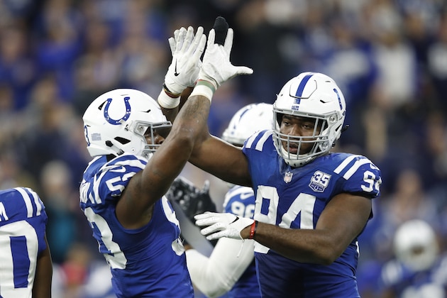 INDIANAPOLIS, INDIANA - DECEMBER 16: Darius Leonard #53 and Tyquan Lewis #94 of the Indianapolis Colts celebrates after a fourth down stop in the game against the Dallas Cowboys in the fourth quarter at Lucas Oil Stadium on December 16, 2018 in Indianapolis, Indiana. (Photo by Joe Robbins/Getty Images)
