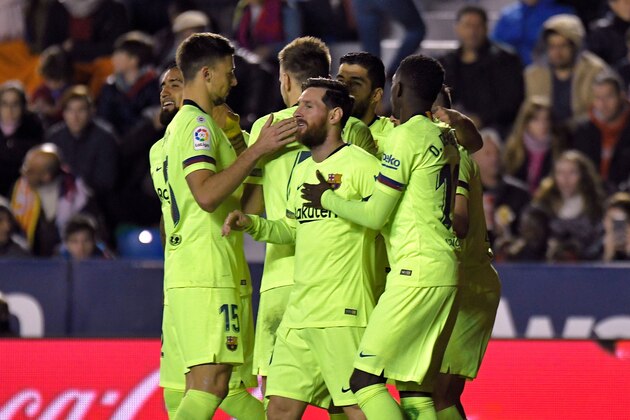 Barcelona's Argentinian forward Lionel Messi (C) celebrates a goal with teammates during the Spanish League football match between Levante and Barcelona at the Ciutat de Valencia stadium in Valencia on December 16, 2018. (Photo by JOSE JORDAN / AFP)        (Photo credit should read JOSE JORDAN/AFP/Getty Images)
