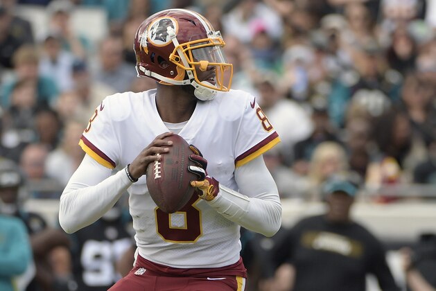 Washington Redskins quarterback Josh Johnson looks for a receiver against the Jacksonville Jaguars during the first half of an NFL football game, Sunday, Dec. 16, 2018, in Jacksonville, Fla. (AP Photo/Phelan M. Ebenhack)