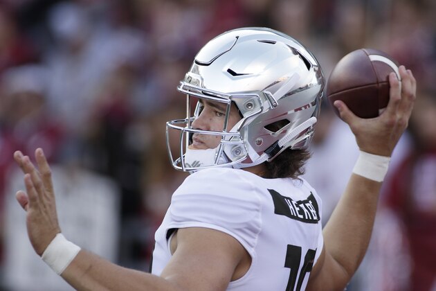 Oregon quarterback Justin Herbert throws a pass during warm ups before an NCAA college football game against Washington State in Pullman, Wash., Saturday, Oct. 20, 2018. (AP Photo/Young Kwak)