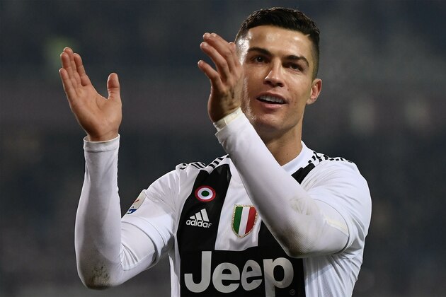 Juventus' Portuguese forward Cristiano Ronaldo applauds at the end of the Italian Serie A football match Torino vs Juventus on December 15, 2018 at the Olympic stadium in Turin. (Photo by Marco BERTORELLO / AFP)        (Photo credit should read MARCO BERTORELLO/AFP/Getty Images)