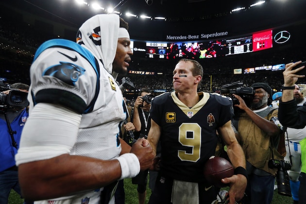 New Orleans Saints quarterback Drew Brees (9) greets Carolina Panthers quarterback Cam Newton after their NFL wild card playoff football game in New Orleans, Sunday, Jan. 7, 2018. The Saints won 36-21. (AP Photo/Butch Dill)