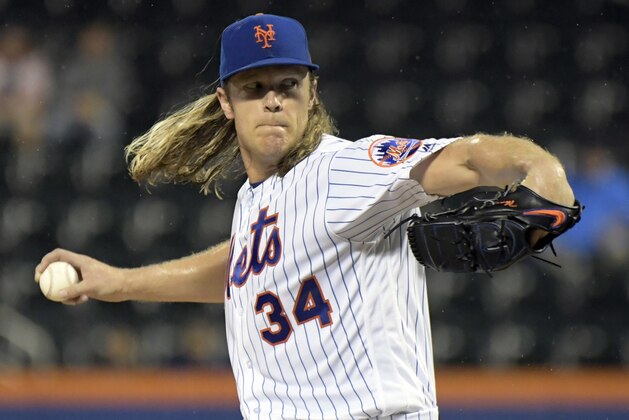 New York Mets pitcher Noah Syndergaard delivers the ball to an Atlanta Braves batter during the first inning of a baseball game Tuesday, Sept. 25, 2018, in New York. (AP Photo/Bill Kostroun)