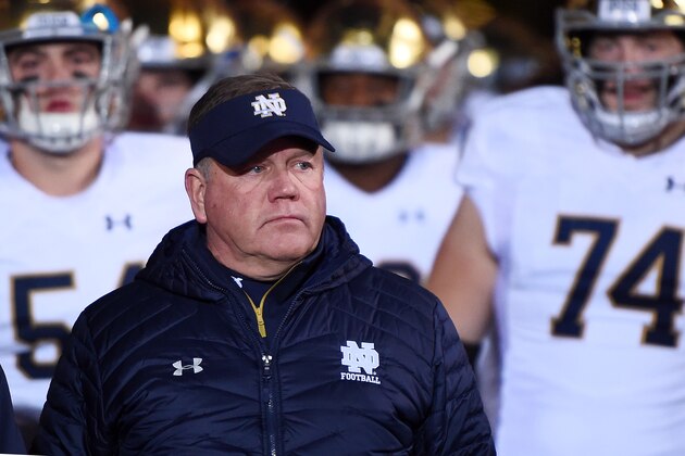 EVANSTON, IL - NOVEMBER 03:  Head coach Brian Kelly of the Notre Dame Fighting Irish leads his team onto the field prior to a game against the Northwestern Wildcats at Ryan Field on November 3, 2018 in Evanston, Illinois.  (Photo by Stacy Revere/Getty Images)