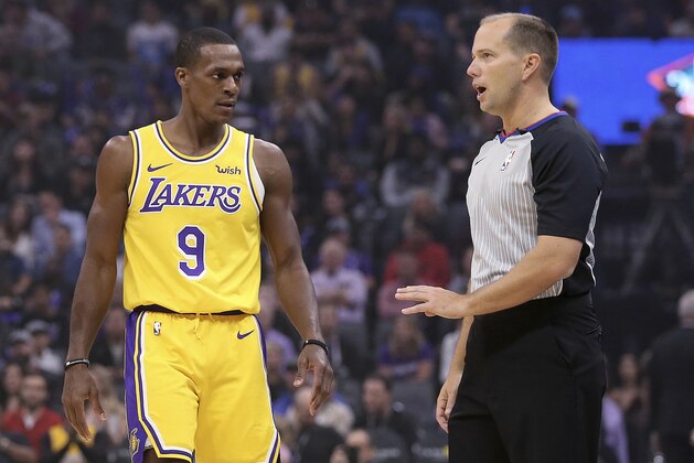 Los Angeles Lakers guard Rajon Rondo questions referee John Goble about the technical foul he called against Rondo during the second half of an NBA basketball game against the Sacramento Kings on Saturday, Nov. 10, 2018, in Sacramento, Calif. The Lakers won 101-86. (AP Photo/Rich Pedroncelli)