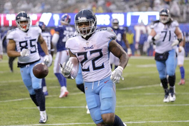 Tennessee Titans running back Derrick Henry (22) tosses the ball to an official after scoring a touchdown run against the New York Giants during the second half of an NFL football game, Sunday, Dec. 16, 2018, in East Rutherford, N.J. (AP Photo/Seth Wenig)
