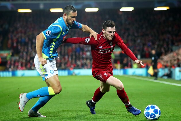 LIVERPOOL, ENGLAND - DECEMBER 11: Andy Robertson of Liverpool tangles with Nikola Maksimovic of Napoli during the UEFA Champions League Group C match between Liverpool and SSC Napoli at Anfield on December 11, 2018 in Liverpool, United Kingdom. (Photo by Clive Brunskill/Getty Images)