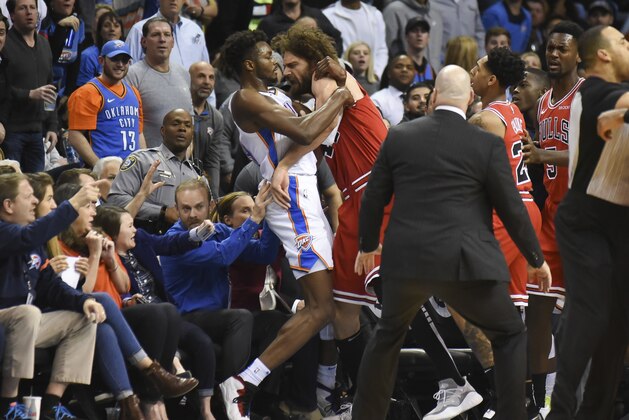 Oklahoma City Thunder forward Jerami Grant, center left, scuffles with Chicago Bull center Robin Lopez, center right, in the second half of an NBA basketball game in Oklahoma City, Monday, Dec. 17, 2018. (AP Photo/Kyle Phillips)