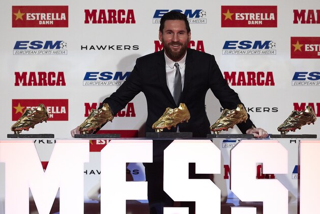 BARCELONA, SPAIN - DECEMBER 18: Lionel Messi of FC Barcelona poses with his five European Golden Shoe awards after receiving the 2017-18 Season European Golden Shoe award for Europe's top scorer for the fifth time during the Golden Shoe Award Ceremony on December 18, 2018 in Barcelona, Spain. (Photo by Quality Sport Images/Getty Images)