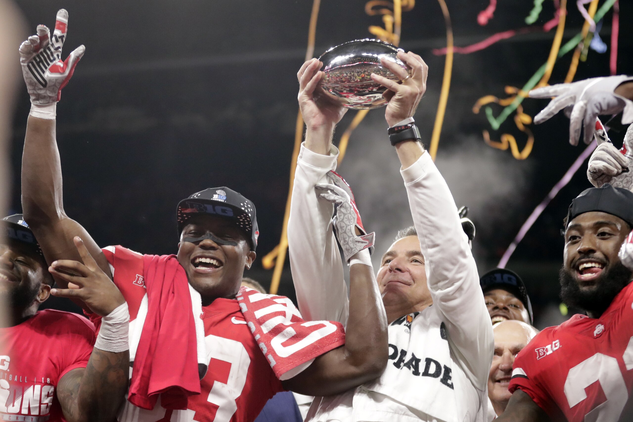 Ohio State head coach Urban Meyer and wide receiver Terry McLaurin, left, celebrate early Sunday, Dec. 2, 2018, after defeating Northwestern 45-24 in the Big Ten championship NCAA college football game in Indianapolis. (AP Photo/Michael Conroy)
